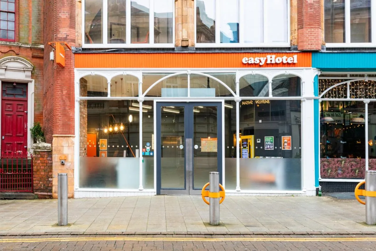 Storefront with open doors on a Birmingham city street at easyHotel Birmingham